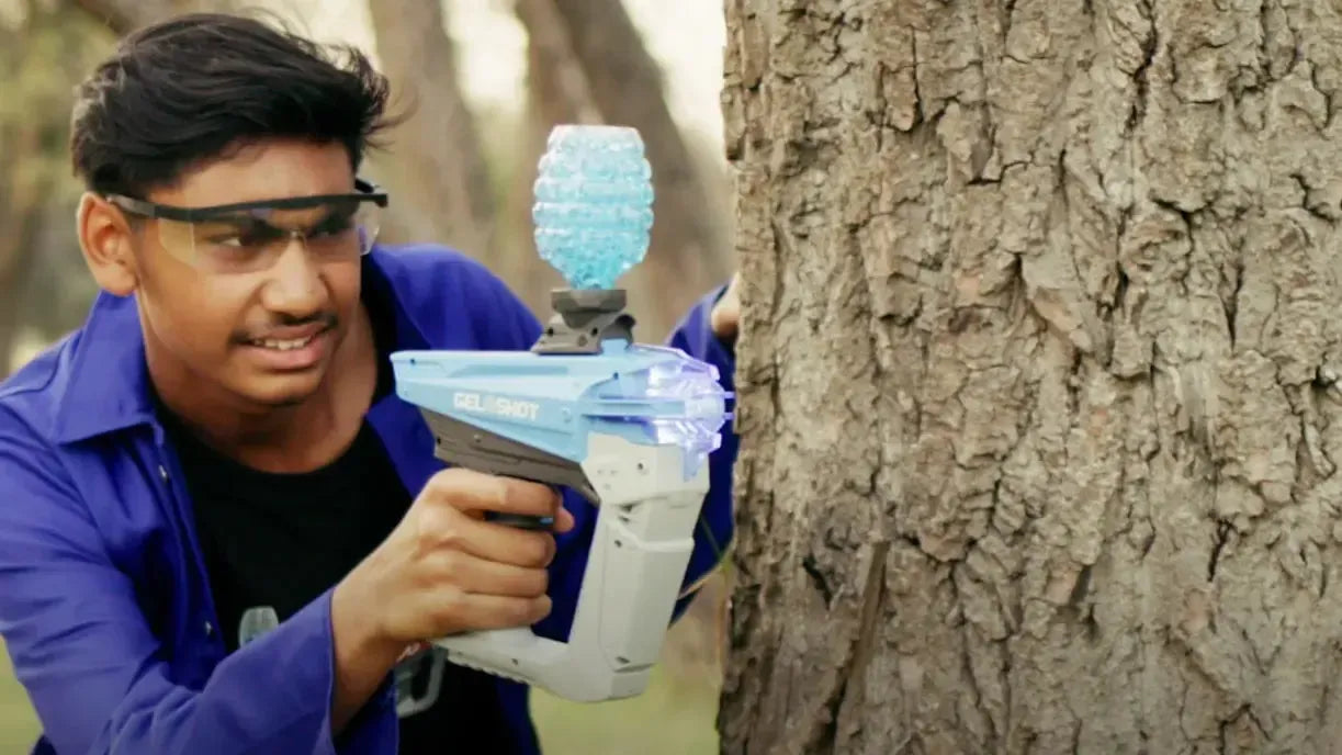 Gel Blaster Hiding by Tree