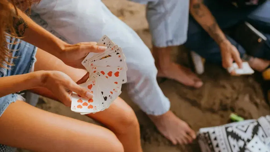 Girl Holding Playing Cards